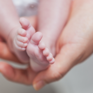 birth injury in Philadelphia and feet of baby in the arms of mother