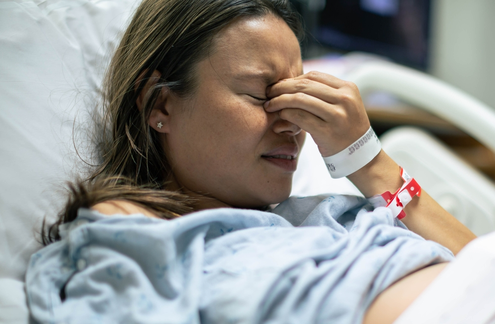 pregnant woman sad because baby suffered a catastrophic birth injury
