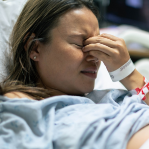 pregnant woman sad because baby suffered a catastrophic birth injury