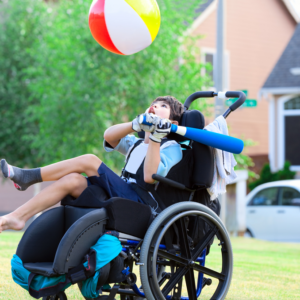 child with cerebral palsy in PA playing with a ball
