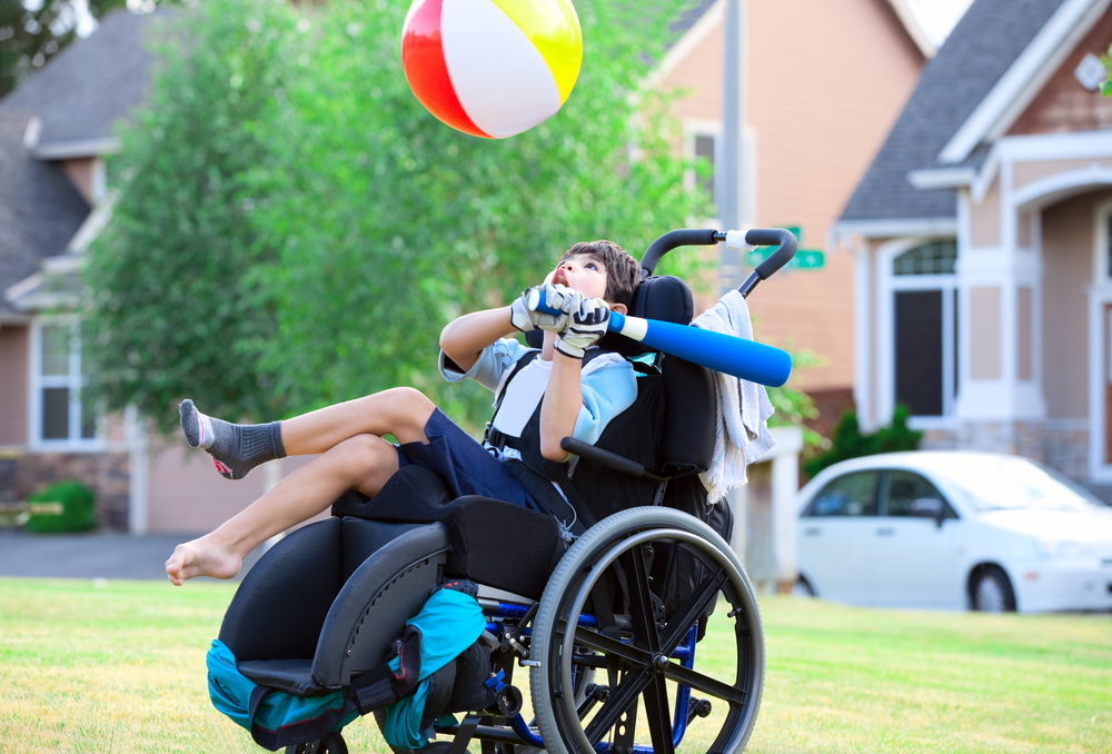 child with cerebral palsy in PA playing with a ball