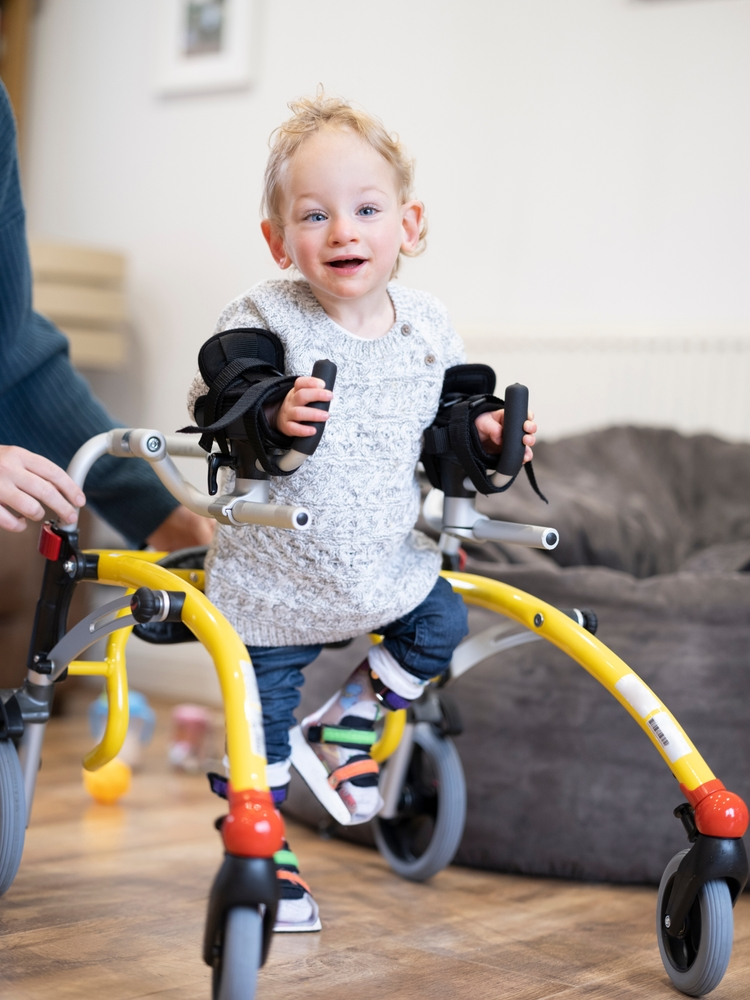 child with brachial plexus injury walking and smiling in Philadelphia