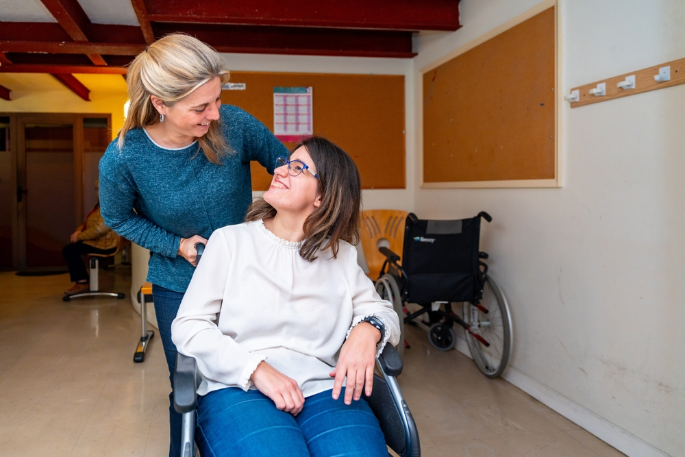 woman with cerebral palsy looking at mom in PA