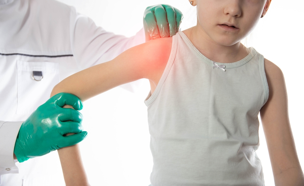 child's arm being checked after a shoulder dystocia injury