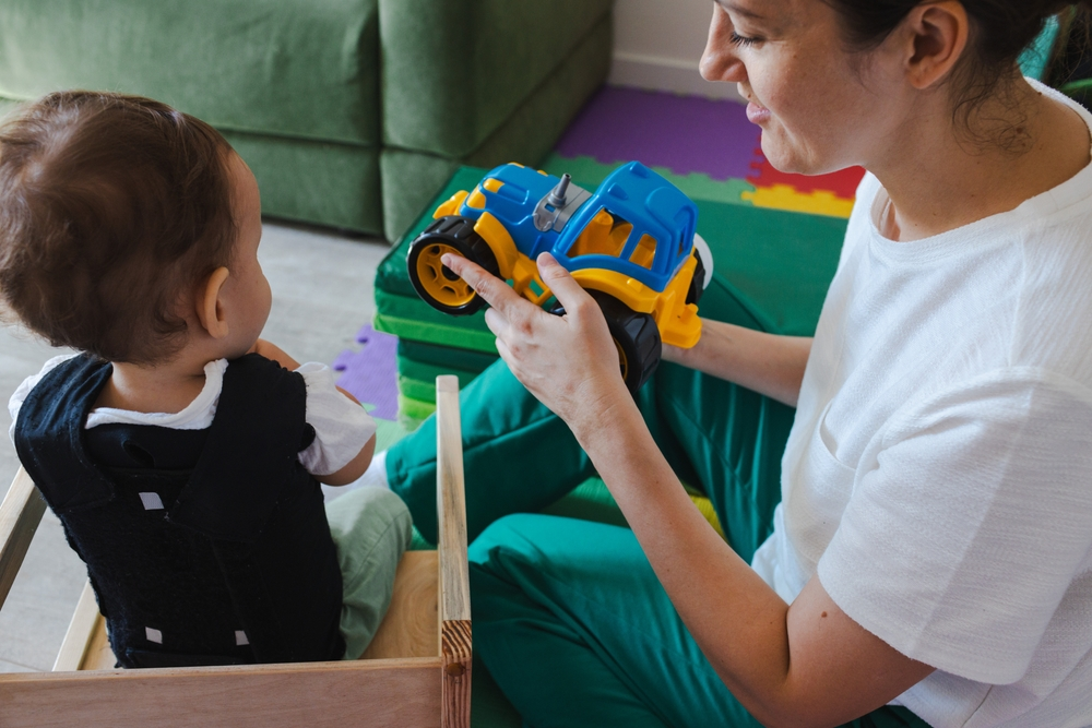 SQCP child playing with their mom