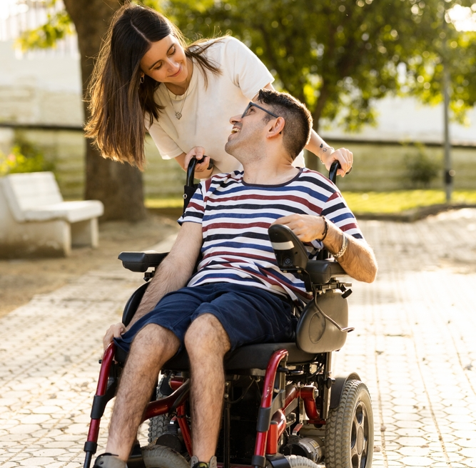 child with cerebral palsy smiling at his caregiver in Philadelphia