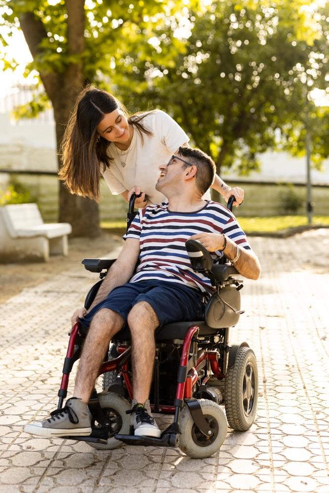 child with cerebral palsy smiling at his caregiver in Philadelphia