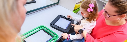 child with birth injury playing with mother in Philadelphia therapy center