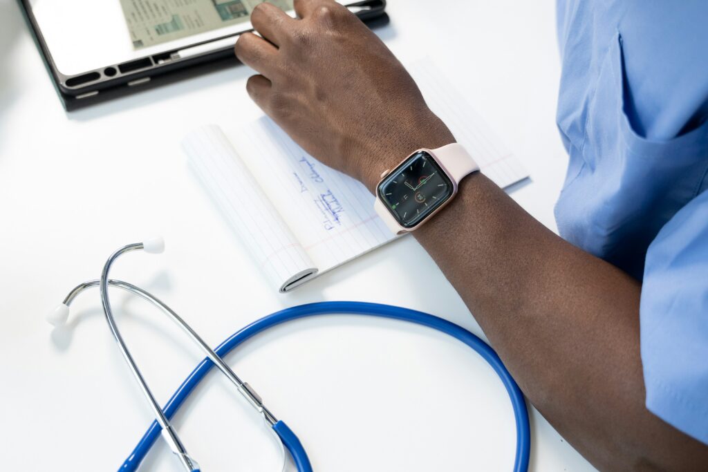 A watch on a doctor's wrist. In the foreground is a stethoscope. When doctors and other medical staff record events, they can create competing timelines in court that may change how the jury perceives certain arguments.