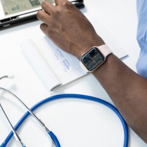 A watch on a doctor's wrist. In the foreground is a stethoscope. When doctors and other medical staff record events, they can create competing timelines in court that may change how the jury perceives certain arguments.