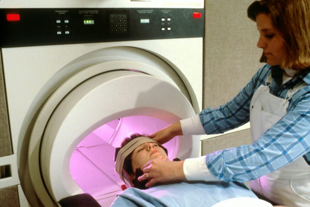 A patient undergoing a scan after their stable head injury progressed.