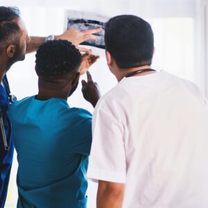 Medical professionals looking at abnormal results. Failure to escalate could make them responsibility for injury.