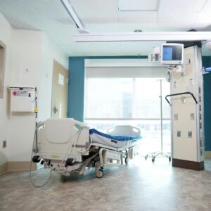 A hospital room with an unoccupied bed turned towards the window. In cases with causation disputes, such as genetic vs. acquired metabolic injury, the main focus is whether on an injury was preventable.
