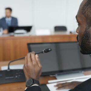 An individual providing expert testimony in a court room.