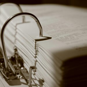 A binder full of documents that show a literal view of standard of care, the clinical guidelines that influence it, and how complex it can be.