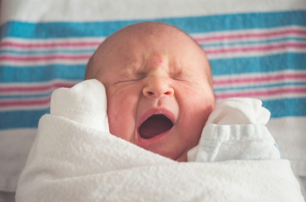 An infant that may have been harmed by being misdiagnosed with the benign infant shudder syndrome.