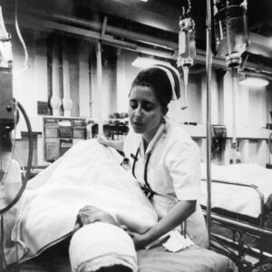 A nurse caring for a patient with multiple injuries after a truck accident.