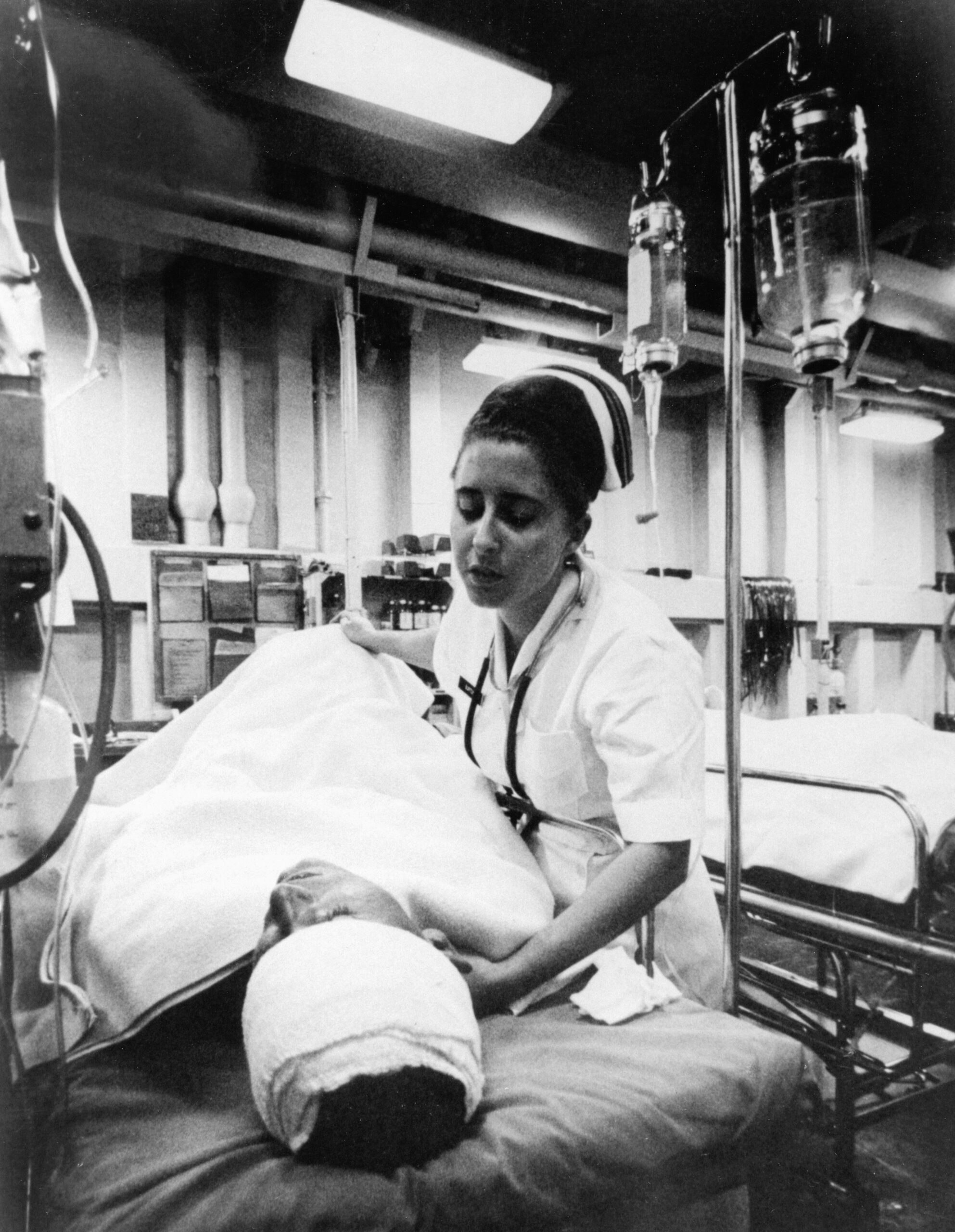 A nurse caring for a patient with multiple injuries after a truck accident.