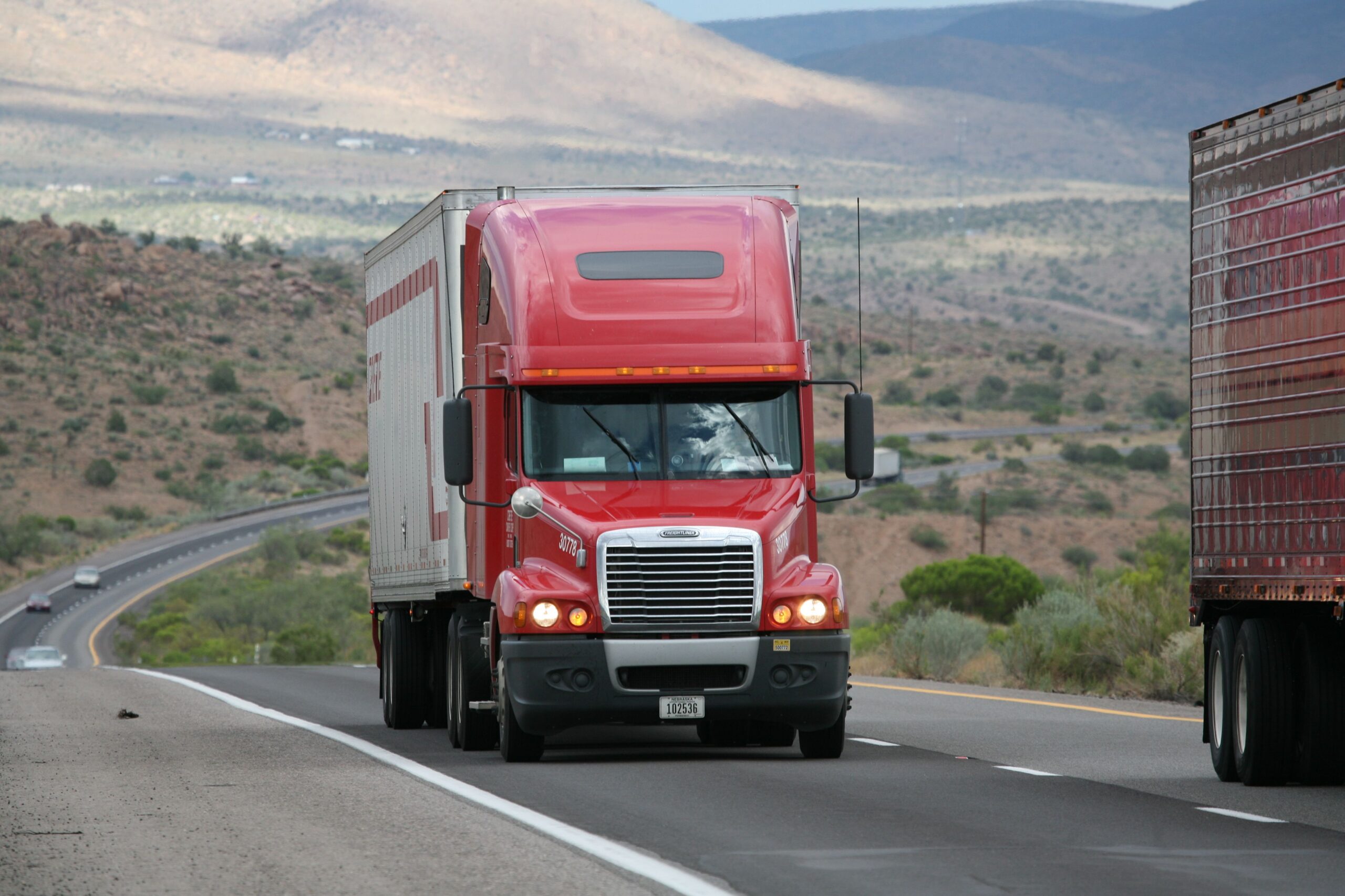 A truck on a highway. Spinal cord injuries are common when tractor trailers such as this crash into passenger vehicles.