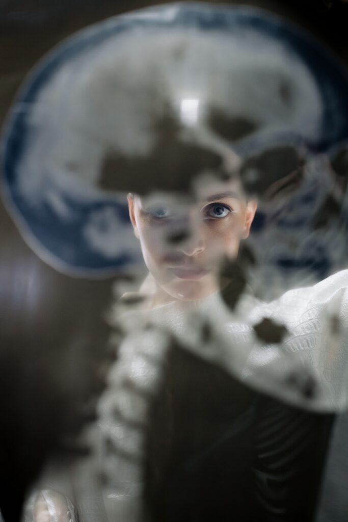 A pair of eyes looking through an x-ray of a skull, symbolic of the failure to recognize gradual neurological decline.