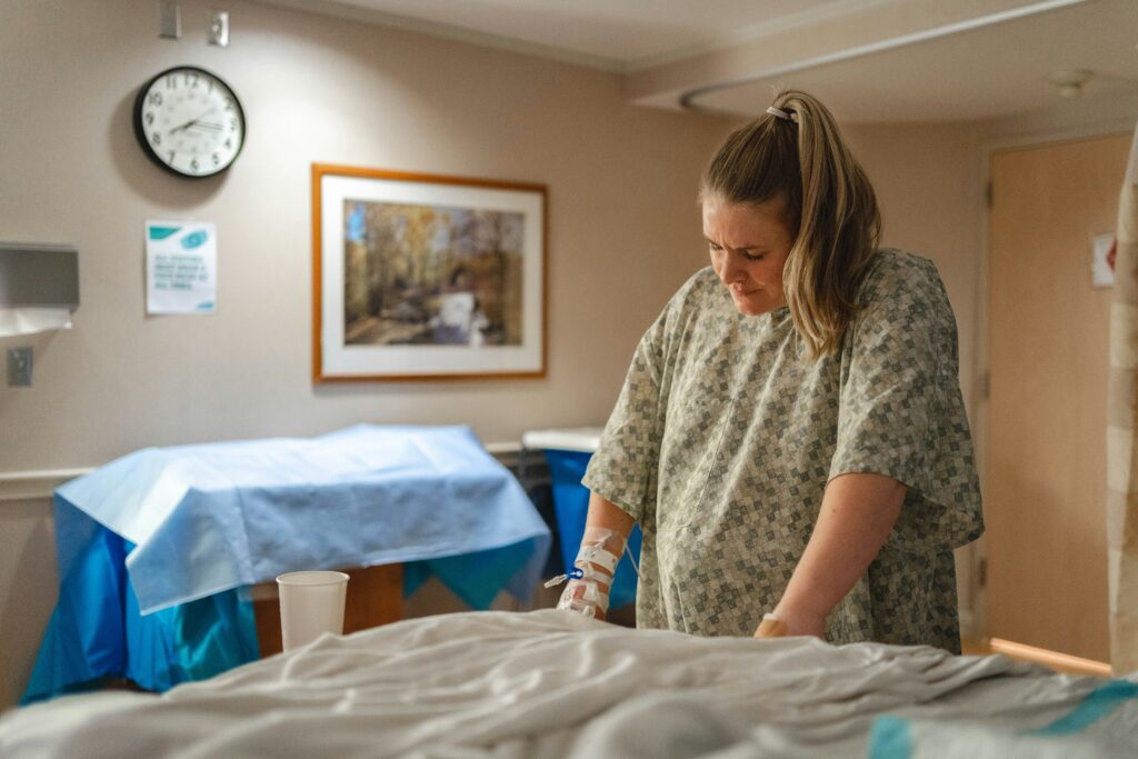 A pregnant woman laboring in a hospital. Maternal hemorrhage may happen suddenly or due to various complications. Regardless of the cause, it must be dealt with quickly to prevent injury to the mother and child.