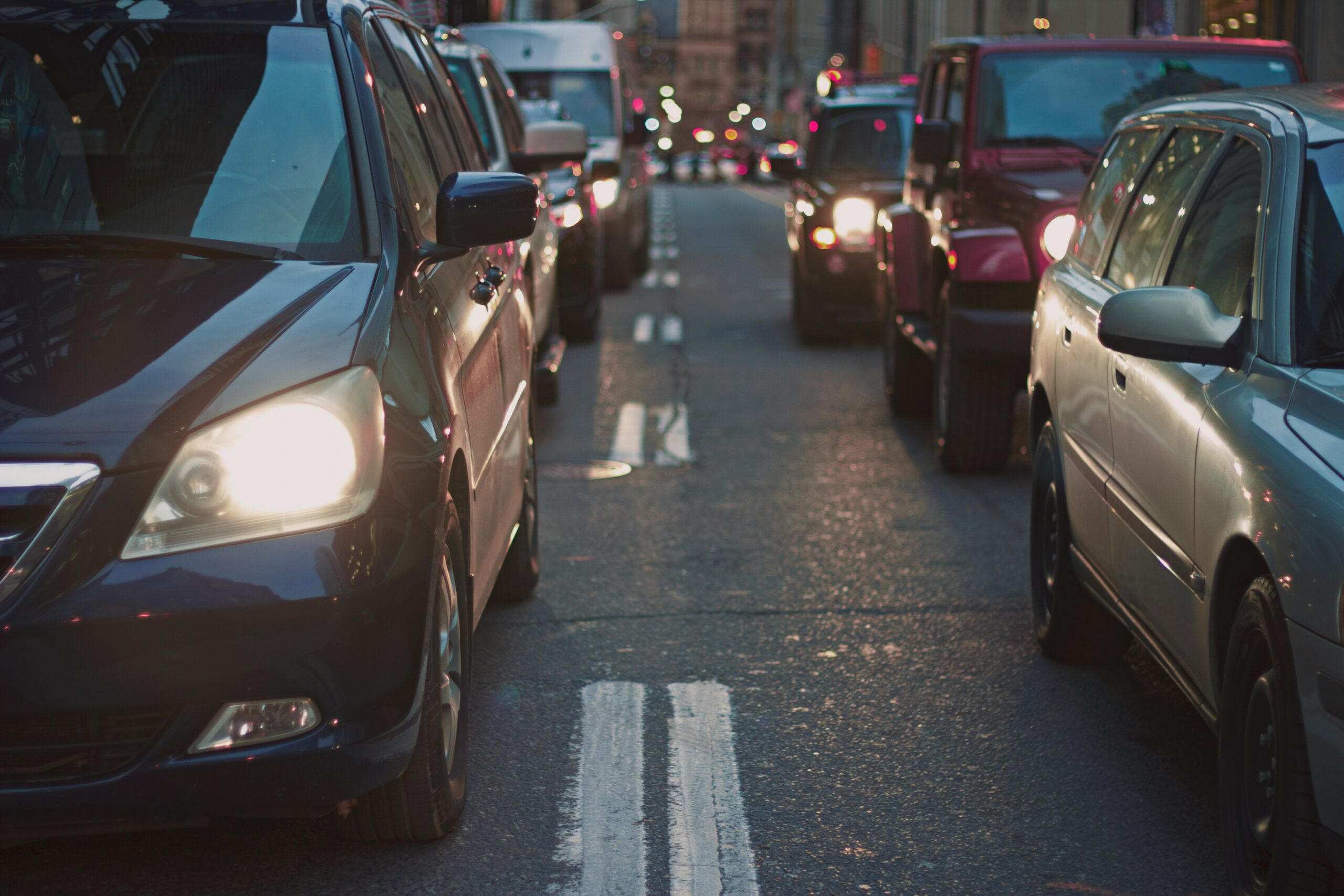 A scenario where a chain-reaction truck accident takes places would most likely occur here, where multiple vehicles are lined up with very little space between them.