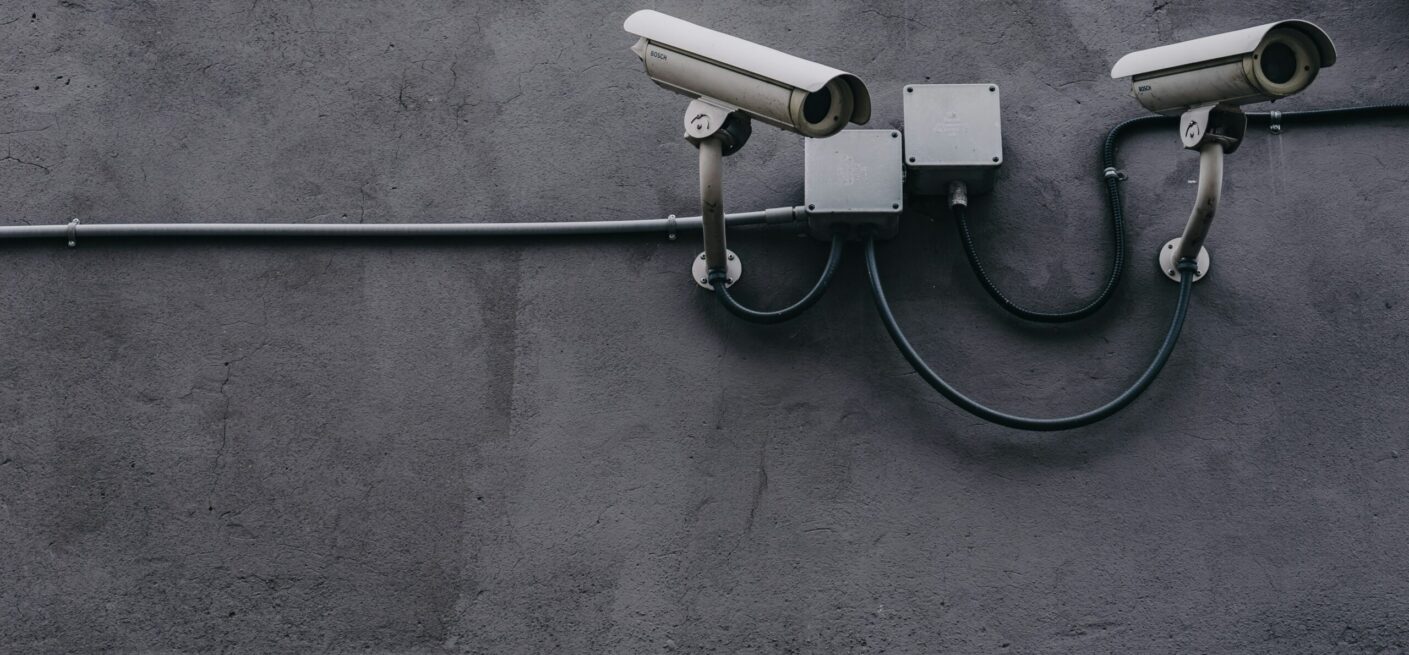 Security cameras mounted on a concrete wall. In a case with negligent security, it may be that such measures do not exist, thus making a property more appealing to criminals.