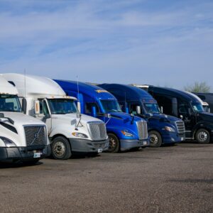A line of trucks. Each one must follow regulations or end up with FMCSA violations, which could be used in a truck accident case.