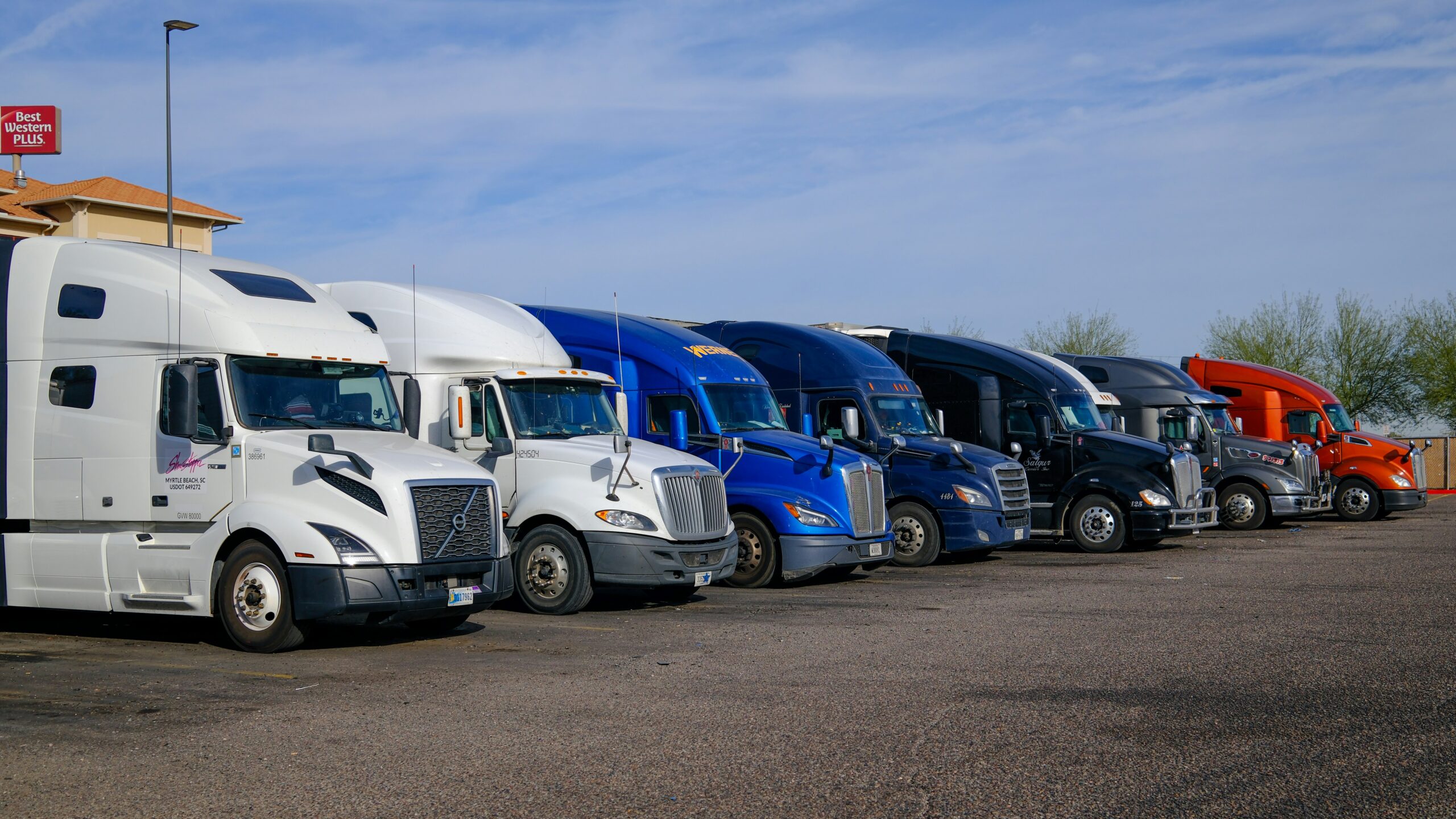 A line of trucks. Each one must follow regulations or end up with FMCSA violations, which could be used in a truck accident case.